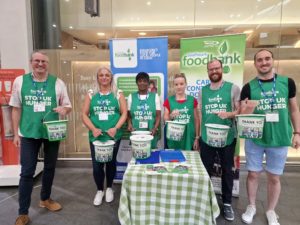 People with donation buckets for Southwark Foodbank